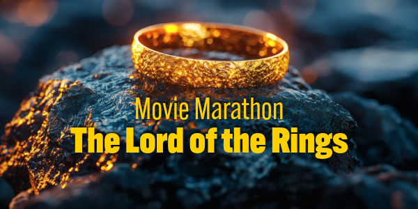 A shining gold wedding-style band laying on a rock.